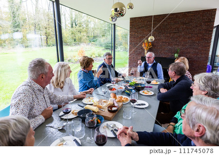 Intimate Family Brunch in a Modern Sunlit Room 111745078