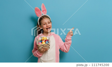 Girl with painted eggs. 111745200