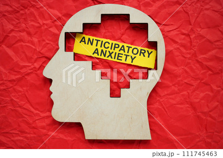 Head model and paper with inscription anticipatory anxiety. Head model and paper with inscription anticipatory anxiety. 111745463