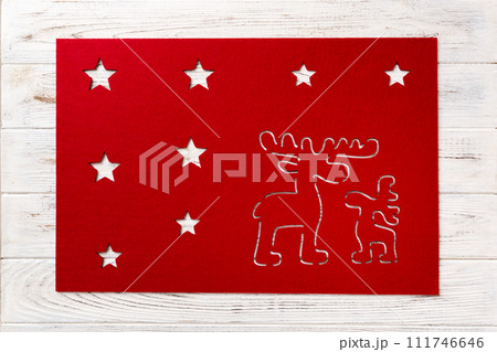 Top view of red tablecloth for food on wooden background. Empty space for your design Top view of red tablecloth for food on wooden background. Empty space for your design 111746646