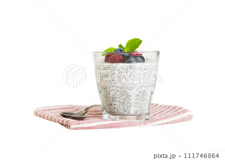 Healthy breakfast or morning with chia seeds vanilla pudding raspberry and blueberry berries on table background, vegetarian food, diet and health concept. Chia pudding with raspberry and blueberry Healthy breakfast or morning with chia seeds vanilla pudding raspberry and blueberry berries on table background, vegetarian food, diet and health concept. Chia pudding with raspberry and blueberry 111746864