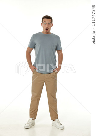 surprised guy looking at camera on white studio background surprised guy looking at camera on white studio background 111747849