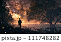 Silhouetted individual stands by a tranquil lake, gazing into a mesmerizing starry night sky surrounded by nature. 111748282