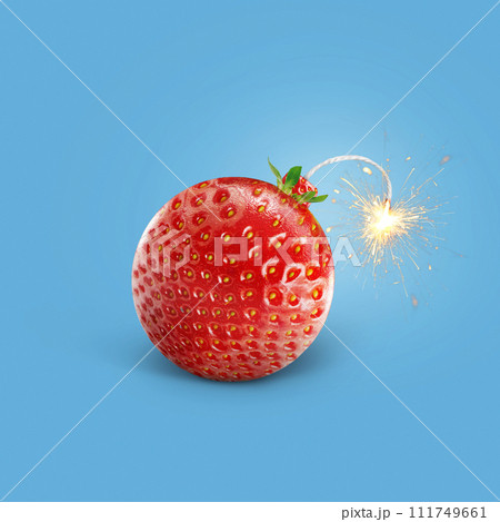 Creative strawberry bomb with wick and sparks burning on a blue background. Vitamins, summer and explosion, creative idea. Healthy food and fruits, concept Creative strawberry bomb with wick and sparks burning on a blue background. Vitamins, summer and explosion, creative idea. Healthy food and fruits, concept 111749661