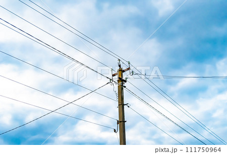 Power electric pole with line wire on colored background close up Power electric pole with line wire on colored background close up 111750964