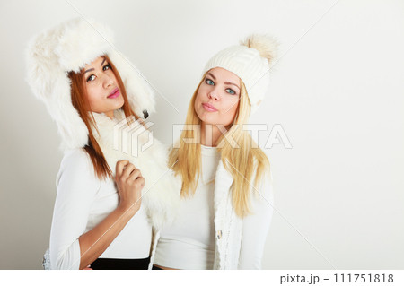 Two women with winter clothes. Two women with winter clothes. 111751818