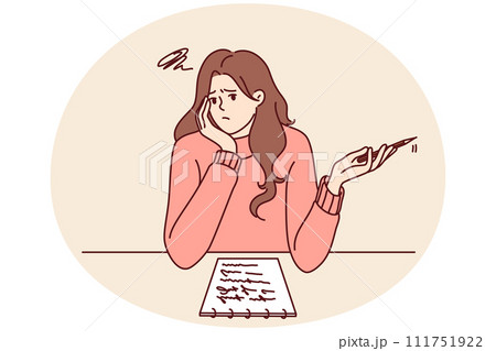 Thoughtful girl sitting at desk thinking about what to write in essay given by teacher in university Thoughtful girl sitting at desk thinking about what to write in essay given by teacher in university 111751922
