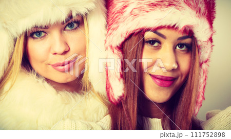 Two girls with winter outfit. Two girls with winter outfit. 111752898