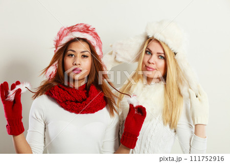 Two girls with winter outfit. Two girls with winter outfit. 111752916