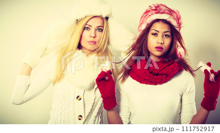Two girls with winter outfit. 111752917