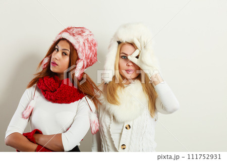 Two girls with winter outfit. Two girls with winter outfit. 111752931