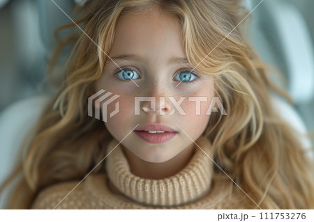 A close-up portrait of a little girl .She is a pretty, sweet, attractive, curious, creative, cheerful girl 111753276