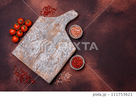 Empty rectangular wooden cutting board on textured concrete background 111753621