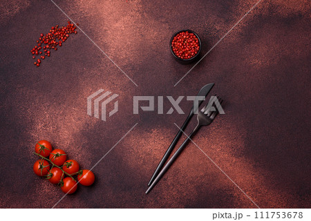 Empty concrete kitchen surface with salt, allspice and cherry tomatoes, copy space 111753678