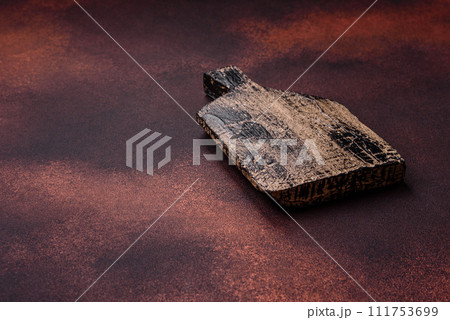 Empty rectangular wooden cutting board on textured concrete background Empty rectangular wooden cutting board on textured concrete background 111753699