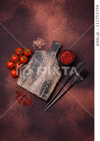 Empty rectangular wooden cutting board on textured concrete background 111753704