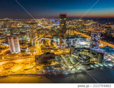 Yekaterinburg city with Buildings of Regional Government and Parliament, Dramatic Theatre, Iset Tower, Yeltsin Center, panoramic view at winter sunset. 111754862