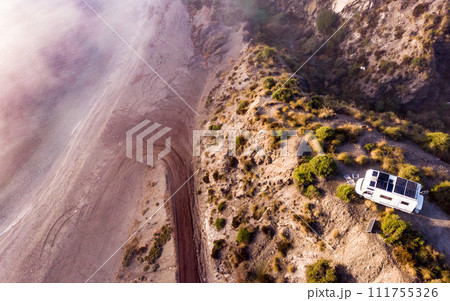 Caravan with solar panels on roof camp on coast, Spain. Aerial view. Caravan with solar panels on roof camp on coast, Spain. Aerial view. 111755326