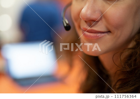 close-up of the face and lips of the girl of the communication and support service operator close-up of the face and lips of the girl of the communication and support service operator 111756364