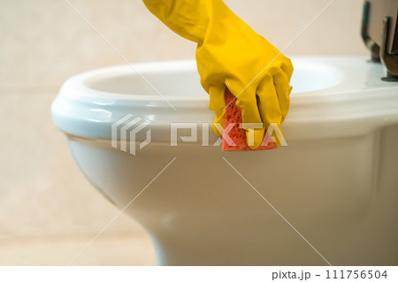 Girl is cleaning house with a detergent. 111756504