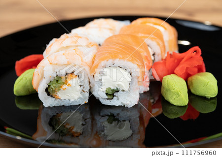 delicious traditional Japanese sushi and rolls on a plate 111756960