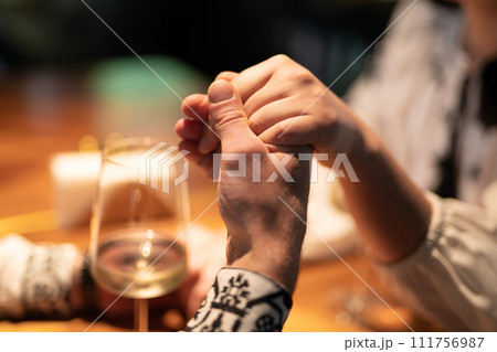 close-up of a couple in love holding hands 111756987