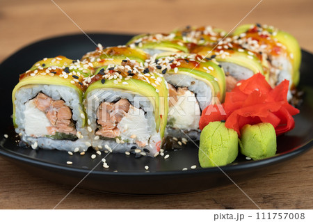 delicious traditional Japanese sushi and rolls on a plate 111757008