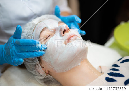 close-up of a girl's face at a cosmetologist during treatment procedures 111757259