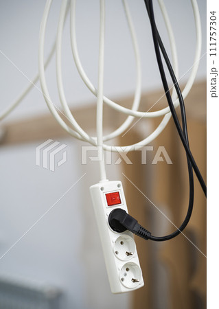 electrical extension cord with sockets for appliances at the factory 111757304