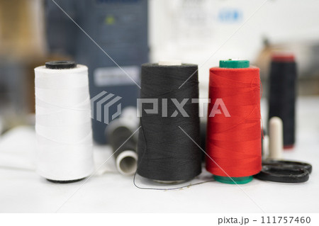 close-up of skeins of thread at an industrial sewing factory for tailoring clothes 111757460