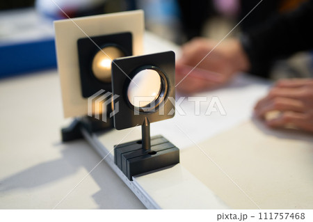 scientists work with optics and light beam in laboratory scientists work with optics and light beam in laboratory 111757468