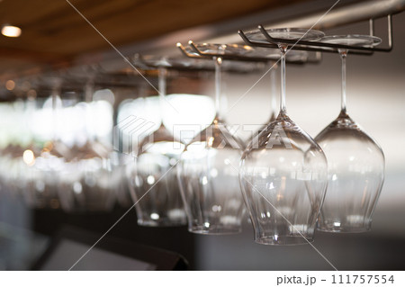 empty clean glass glasses for alcoholic drinks in a restaurant on a bar counter 111757554
