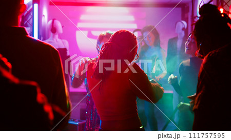 People partying interrupted by police officers, young adults seeing police sirens or lights and stopping the music. Men and women being afraid of law enforcement at nightclub. Handheld shot. People partying interrupted by police officers, young adults seeing police sirens or lights and stopping the music. Men and women being afraid of law enforcement at nightclub. Handheld shot. 111757595