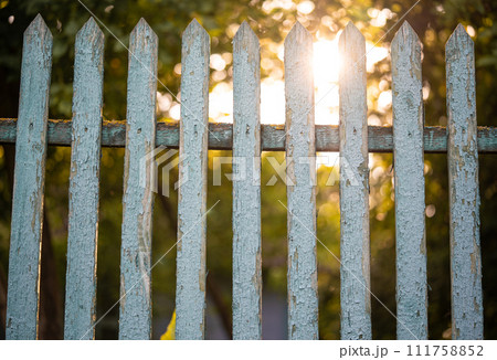 beautiful wooden fence in the village in the contrast sunlight beautiful wooden fence in the village in the contrast sunlight 111758852