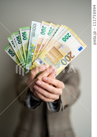business lady holds euro bills in her hands 111758994