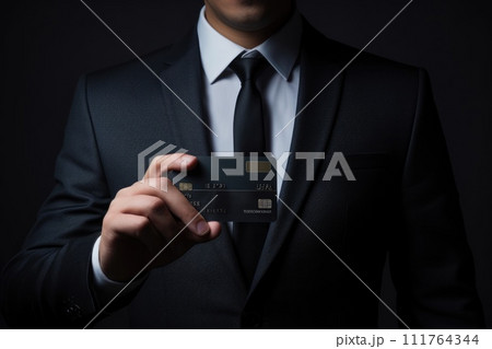 Close up of a man in a suit holding a credit card. Generative AI. 111764344