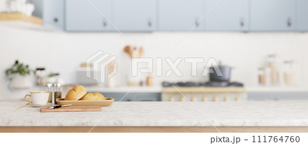 A copy space for display your product on a kitchen tabletop in a cozy minimal kitchen. A copy space for display your product on a kitchen tabletop in a cozy minimal kitchen. 111764760