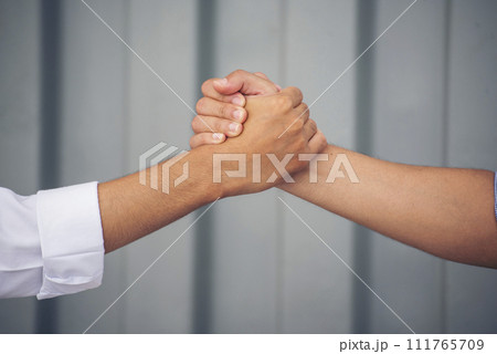 Close up warehouse worker shakehand together. Engineer man hands partnership. Diversity Coworker Men logistics Warehouse teams handshake. Multiracial Support team greeting person teamwork colleagues Close up warehouse worker shakehand together. Engineer man hands partnership. Diversity Coworker Men logistics Warehouse teams handshake. Multiracial Support team greeting person teamwork colleagues 111765709