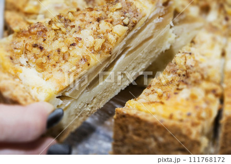 diet. Want a sweet at night. Struggle for health. Cake and hand rake a piece of cake 111768172