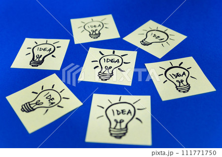Light bulbs drawn on sticky notes. Hand drawn doodle lineart. Idea, inspiration and creative thinking 111771750