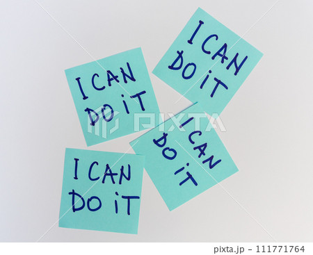 I can do it quote, phrase written on a sticky notes over white board 111771764