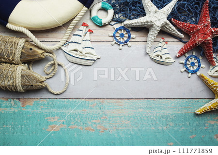 Nautical and summer background top view on wooden background Nautical and summer background top view on wooden background 111771859