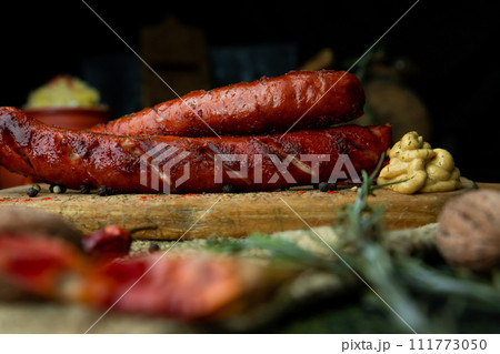 Sausages with cheese fried with spices and herbs Sausages with cheese fried with spices and herbs 111773050