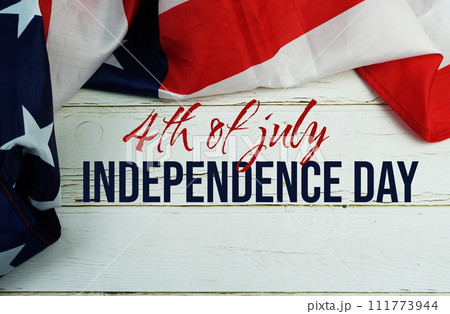 Happy Forth of July Independence Day text messege  with USA flag on wooden background 111773944