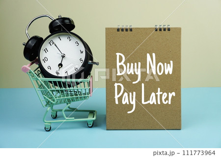 Buy Now Pay Later text message with trolley cart and alarm clock for business and commercial concepts background Buy Now Pay Later text message with trolley cart and alarm clock for business and commercial concepts background 111773964