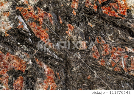 Macro of a stone Stibnite mineral on a white background Macro of a stone Stibnite mineral on a white background 111776542