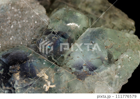 macro mineral fluorite stone on black background 111776579
