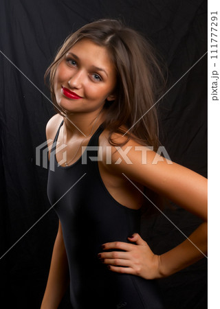 Young pretty woman in gymnastic suit Young pretty woman in gymnastic suit 111777291
