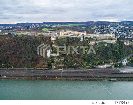 Ehrenbreitstein Fortress aerial panoramic view in Koblenz. Koblenz is city on Rhine, joined by Moselle river Ehrenbreitstein Fortress aerial panoramic view in Koblenz. Koblenz is city on Rhine, joined by Moselle river 111778458