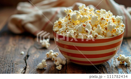 Salt popcorn on the wooden table, selective focus 111782434
